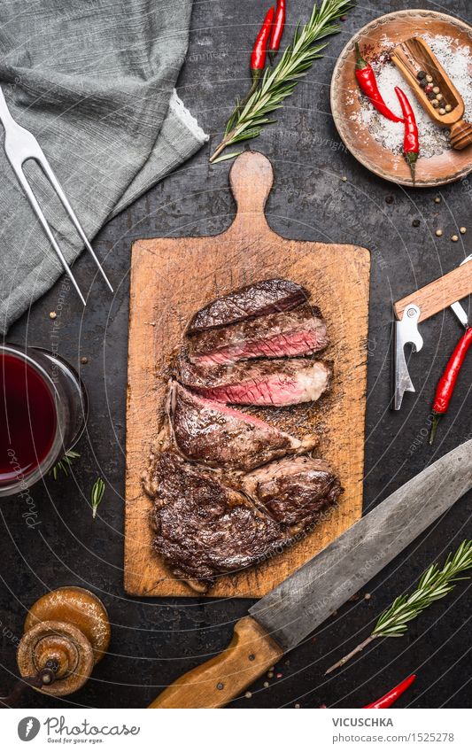 Medium grilled rump steak Food Meat Herbs and spices Cooking oil Nutrition Lunch Banquet Business lunch Organic produce Beverage Wine Knives Fork Healthy Eating
