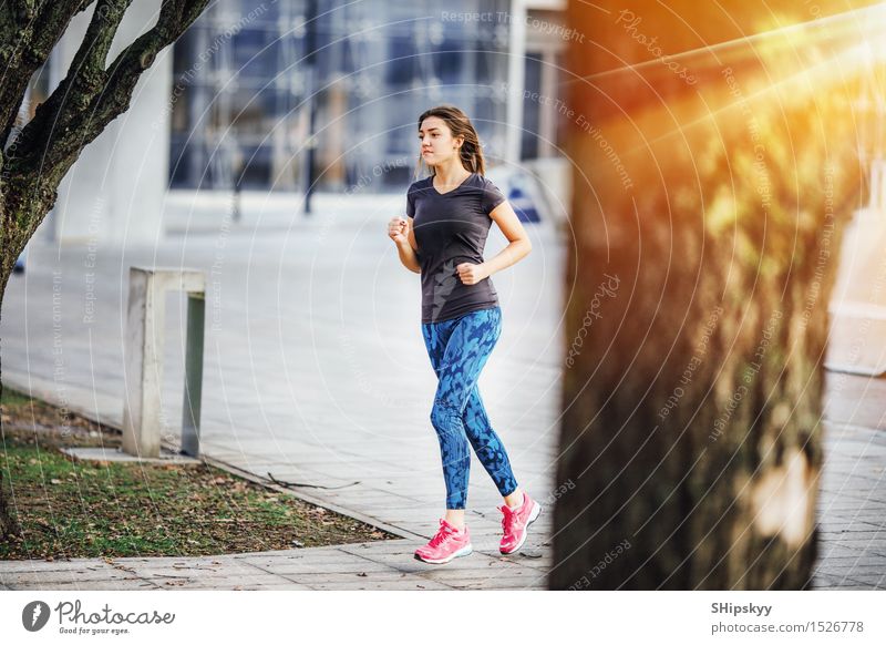 Young girl running at morning sunshine Sports Fitness Sports Training Fan Success Human being Young woman Youth (Young adults) Woman Adults Life Body Legs 1