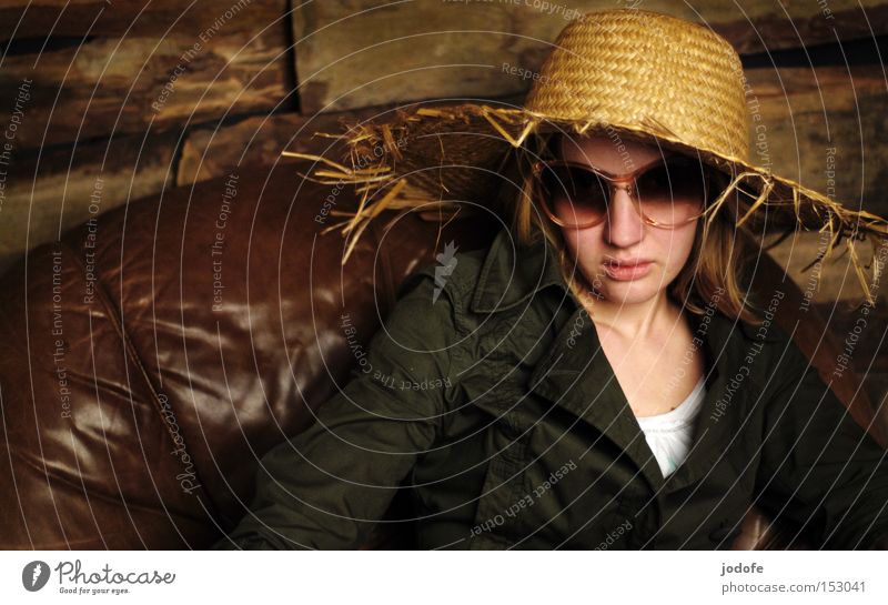 prost new year! Woman Human being Portrait photograph Straw hat Wooden wall Armchair Leather Sunglasses Cool (slang) Sit Mistrust Hard-nosed Face Might