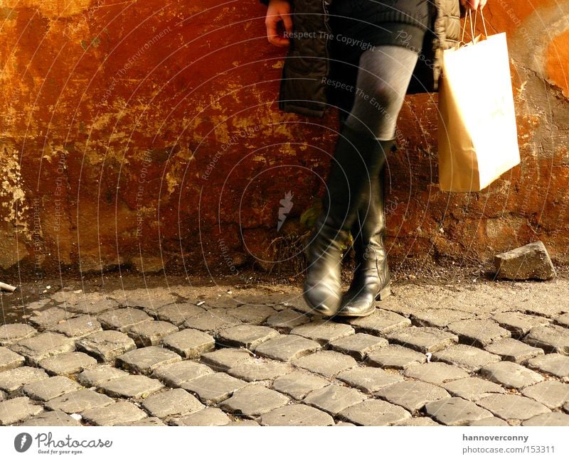 Shopping in Rome Paper bag Dirty Skirt Boots Easygoing Rust Cobblestones Break Lean Woman Thin Beautiful Derelict