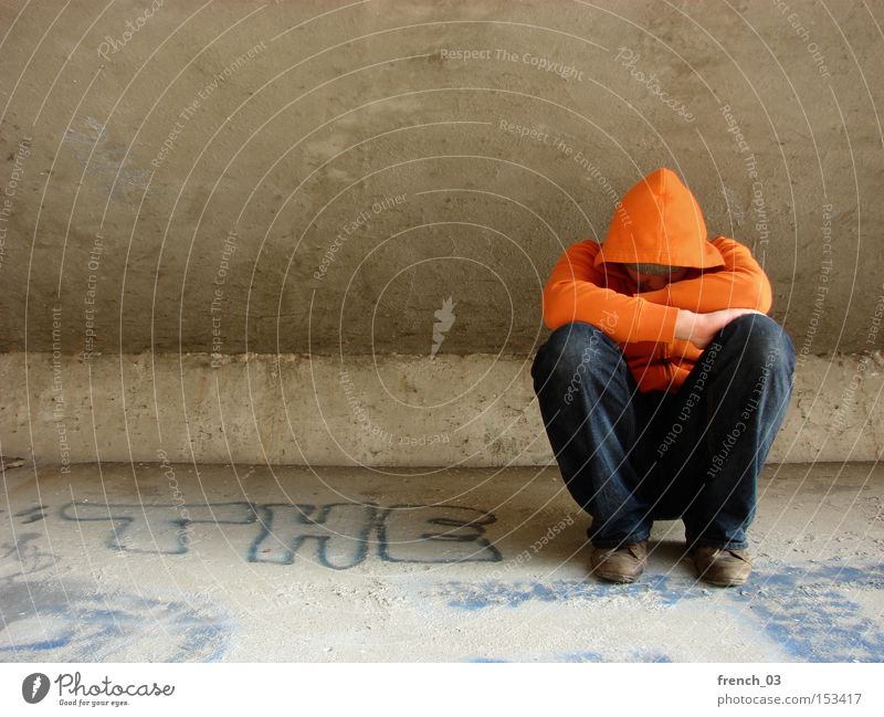 "The" guy with the hood Hooded (clothing) Human being Orange Concrete Bridge Sit Interlock Interlocked Anonymous Emit Grief Distress Tramp Cheap Loneliness