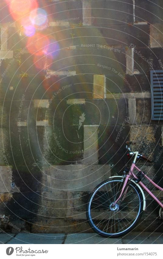 travel dreams Wall (barrier) Wall (building) Parking area Wait Bicycle Pink Light Beam of light Lens flare Multicoloured Beautiful Longing Dream Wanderlust