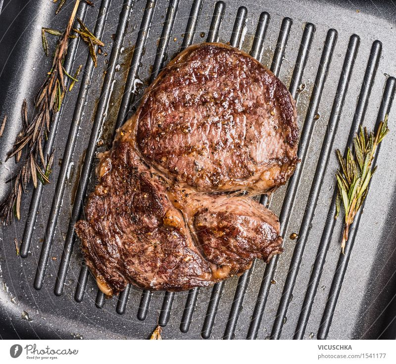 Grilled Steak Striploin on Grill Iron Pan Food Meat Herbs and spices Cooking oil Nutrition Lunch Dinner Banquet Business lunch Style Kitchen Restaurant