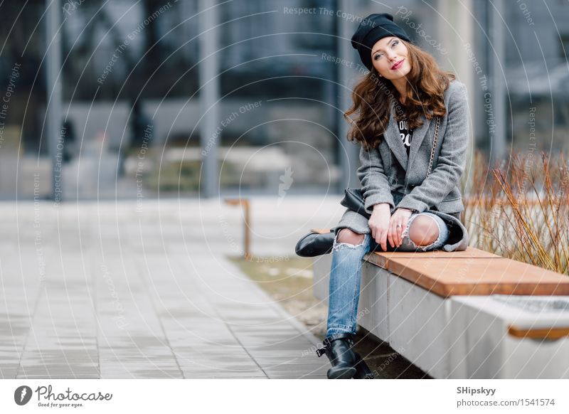 Young woman sitting on the street Lifestyle Elegant Style Joy Happy Beautiful Face Leisure and hobbies Camera Human being Girl Woman Adults Town Street Fashion