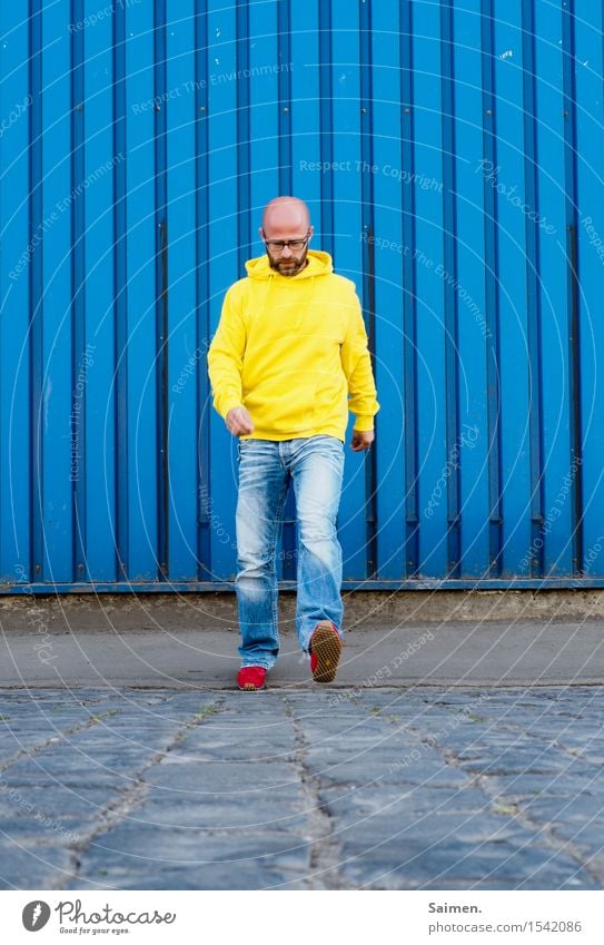 blazing Human being Masculine Man Adults Body 1 30 - 45 years Going Yellow Jeans Hooded sweater Walking Stride Eyeglasses Bald or shaved head Play of colours