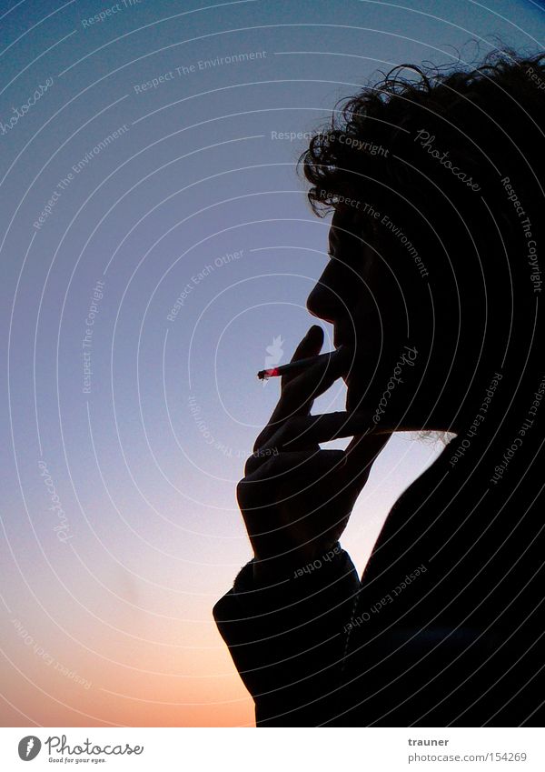 Thinking about smoking... Colour photo Subdued colour Exterior shot Neutral Background Evening Twilight Light Shadow Contrast Silhouette Sunlight Sunbeam