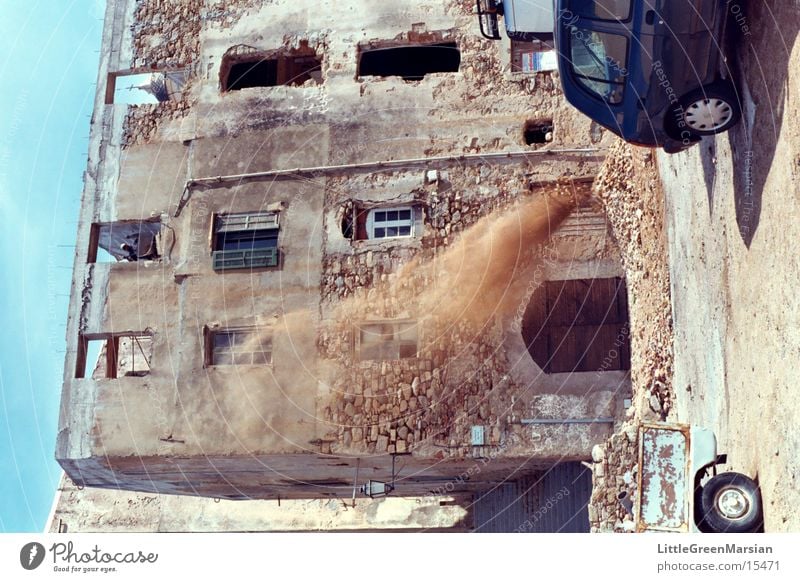 safety?!? Working man Corsica Building rubble Wheelbarrow Architecture old house dust[cloud] Wind