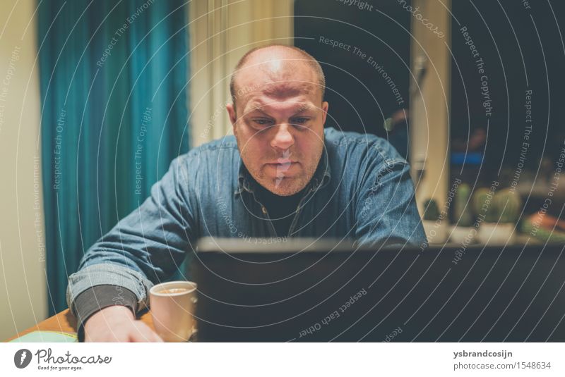 Chubby Man Browsing Internet Using a Computer Coffee Face Relaxation Reading Table Living room Work and employment Screen Human being Adults Sit balding