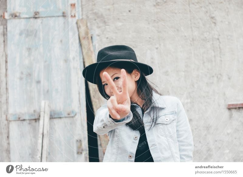 peekaboo Black-haired Long-haired Cool (slang) Authentic Free Happiness Happy Funny Hat Jeans jacket Tourist Vacation & Travel Discover Barn Hide Peace Sign