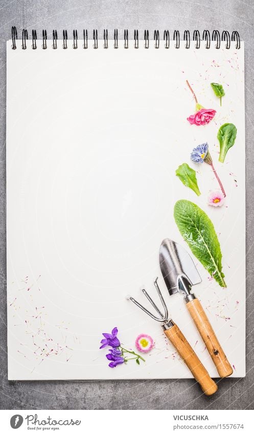 Garden tools with flower parts on empty notebook . Style Design Summer Decoration Nature Plant Spring Flower Leaf Blossom Paper Piece of paper Sign Ornament