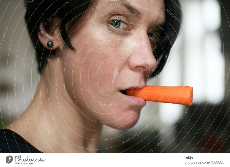 Woman with carrot instead of cigarette in the corner of her mouth Food Vegetable Carrot Raw vegetables Nutrition Eating Organic produce Vegetarian diet Diet