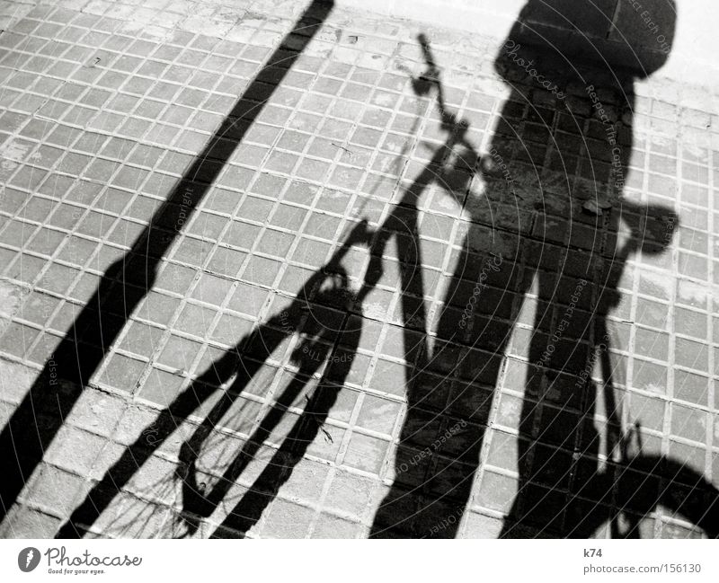 lock it Shadow Silhouette Bicycle Lantern Close Square Purloin Theft Traffic infrastructure Human being Transport