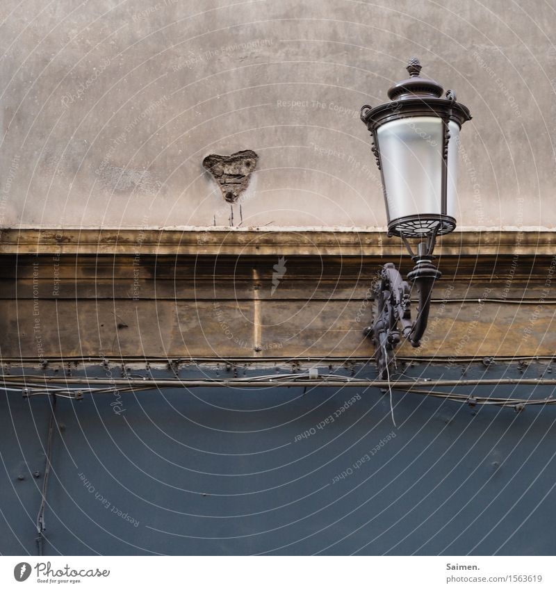 Lamp with heart Old town House (Residential Structure) Wall (barrier) Wall (building) Facade Dirty Lampshade Heart Colour photo Exterior shot Deserted