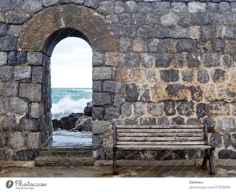 Bank at the sea in front of wall Ocean ocean Bench bench Rock stones Wall (barrier) City wall Italy Mediterranean sea Waves Surf detail Coast White crest Nature