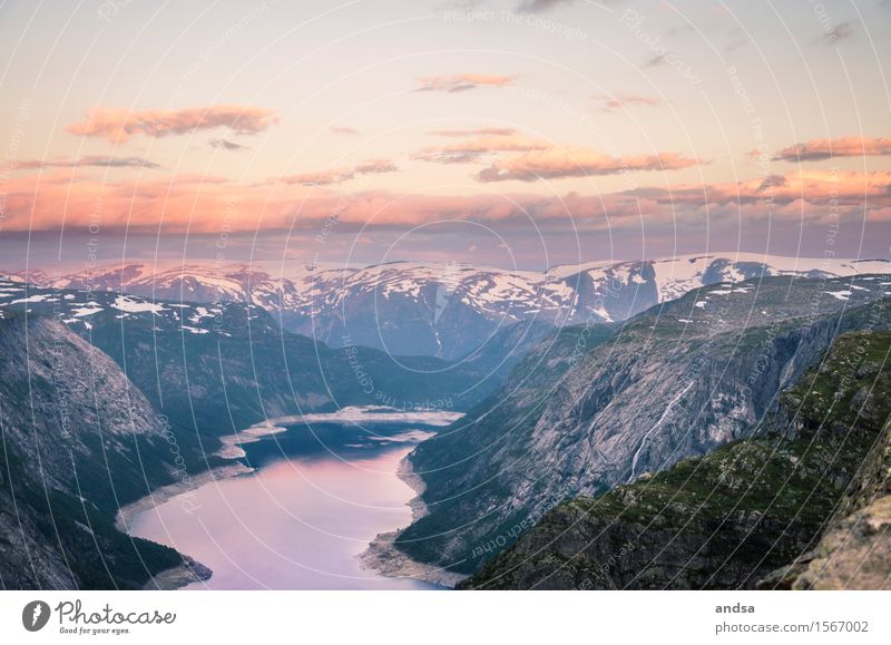 Sunset with a view of a fjord Fjord Mountain range Dusk Twilight Sky Night Evening Peak Snow cloud Clouds floodlit clouds Nature Landscape Deserted