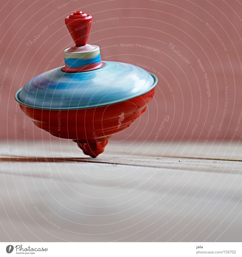 Turn around... turn around... Dance Contentment Rotate Rotation Gyroscope Wooden floor Colour Red Multicoloured Tin Toys Movement Wall (building) Joy