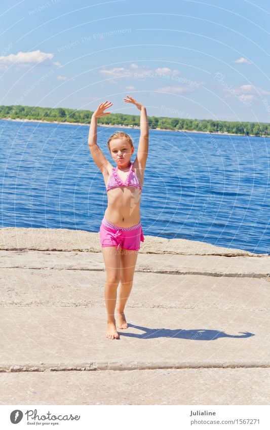 Girl on the riverbank in pink swimsuit Joy Playing Summer Beach Ocean Child Schoolchild Woman Adults Infancy 8 - 13 years River bank Blonde Movement Smiling