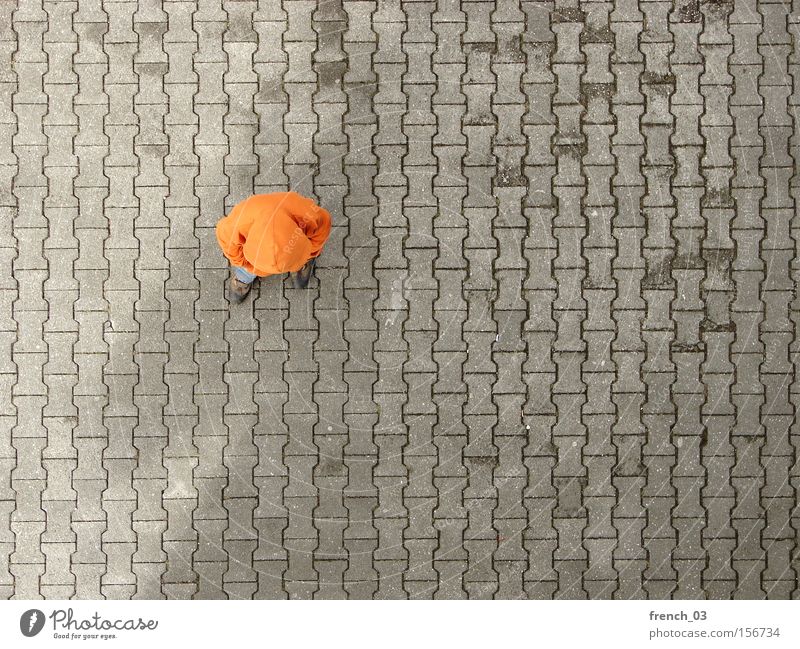 fading shadow Human being 1 Places Traffic infrastructure Clothing Sweater Stone Concrete Line Stand Wait Gloomy Gray Boredom Colour Orange Hooded (clothing)
