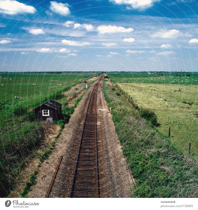 To infinity Railroad Tracks Destination Far-off places Gravel Line (row of words) Metal Steel Means of transport Level Flat England Communicate sleepers train