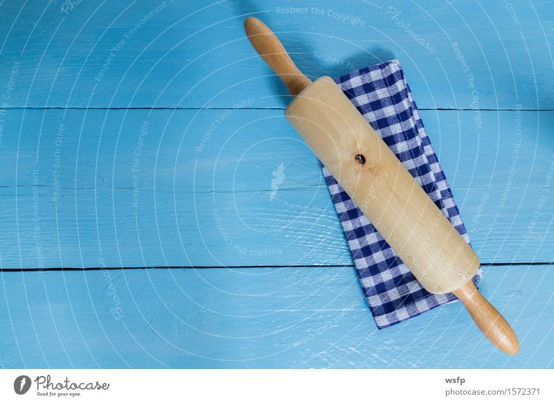 rolling pin and tea towel on blue wood background Kitchen Restaurant Gastronomy Old Blue White Rolling pin noodle walker dough roll baking roll Dish towel