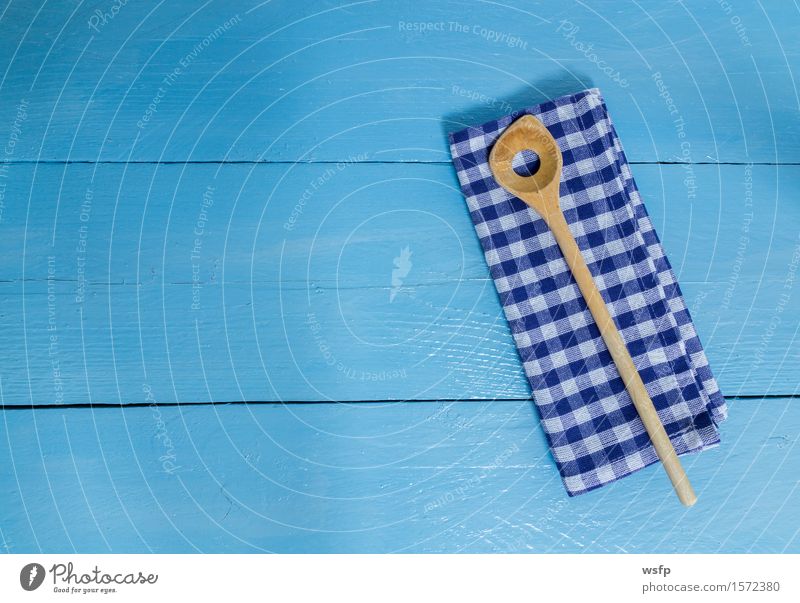 Cooking spoon and tea towel on blue wooden background Kitchen Restaurant Gastronomy Wooden spoon Old Blue White Dish towel kitchen towel Wooden board