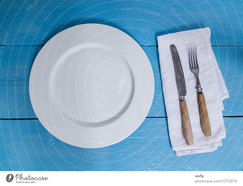 Cutlery and plate on blue wood background Plate Fork Kitchen Restaurant Gastronomy Old Blue White Empty Napkin Knives Wooden board Wooden table Wooden sign