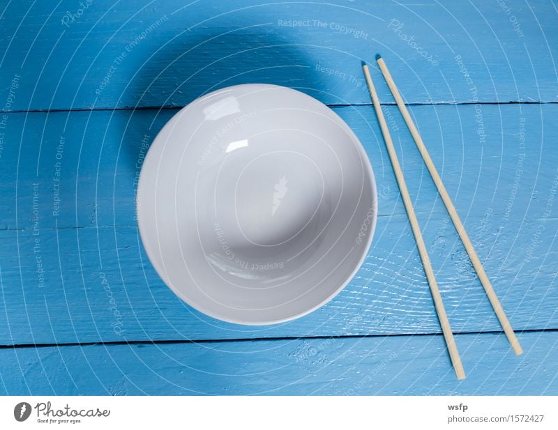 Bowl with sticks on blue wood in bird's eye view Restaurant Gastronomy Old Blue White shell Chopstick Empty Wooden board Wooden table Wooden sign boards Menu