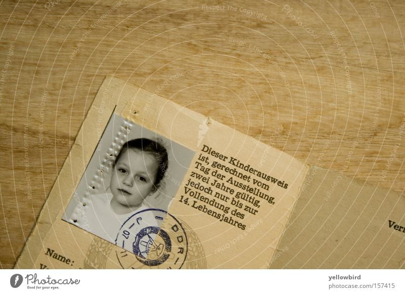 Back in the GDR. Child Authentic Historic Curiosity Cute Original Gloomy Feminine Brown Identification East Travel pass Passport photograph Photography child ID