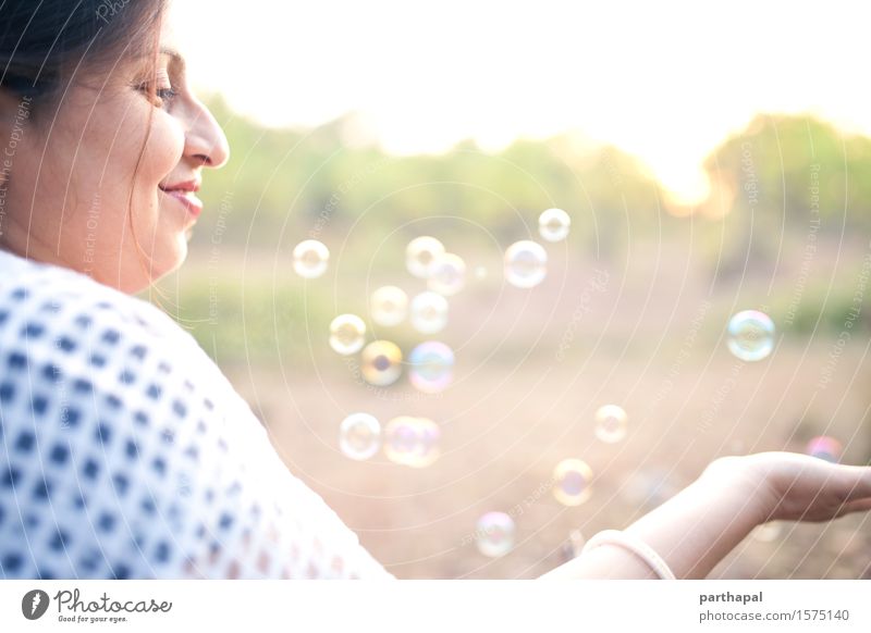 Woman with bubbles Human being Feminine Young woman Youth (Young adults) Adults Face 1 30 - 45 years Nature Air Sunrise Sunset Sunlight Summer Catch To enjoy