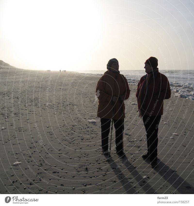 winter stroll Sun Light Shadow 2 Beach Ocean Winter To talk Human being Back-light Contrast Denmark North Sea Coast Woman