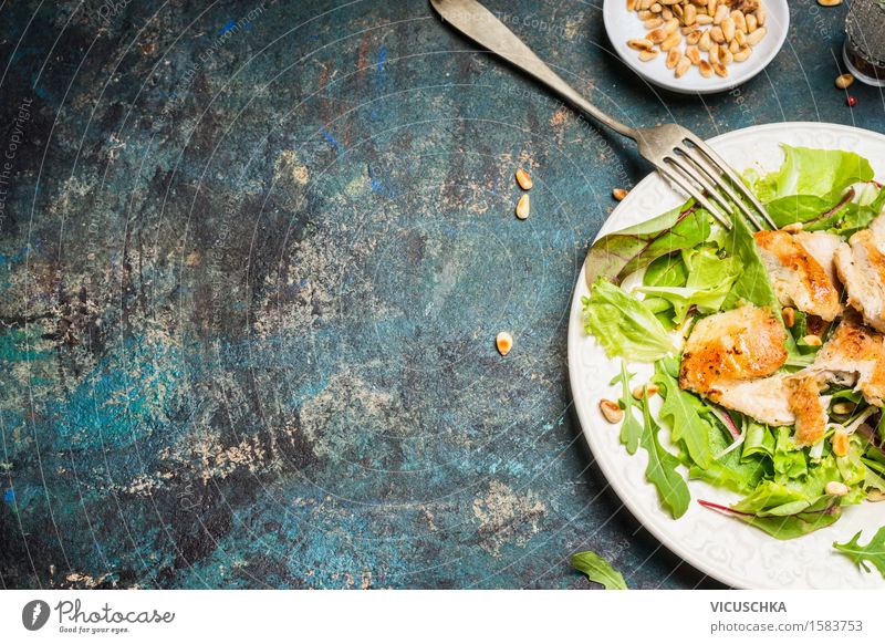 Chicken salad with pine nuts on a rustic background Food Meat Lettuce Salad Nutrition Lunch Dinner Organic produce Diet Crockery Fork Restaurant Yellow Design