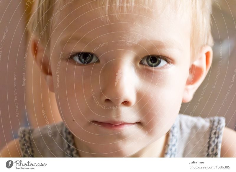 Cute boy with blond hair - a Royalty Free Stock Photo from Photocase