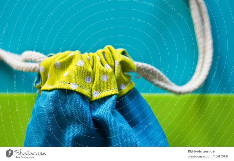 close the bag Sack Pouch Cloth Blue Green Closed Bring in Sewing String Colour photo Interior shot Detail Copy Space top Day Blur Shallow depth of field