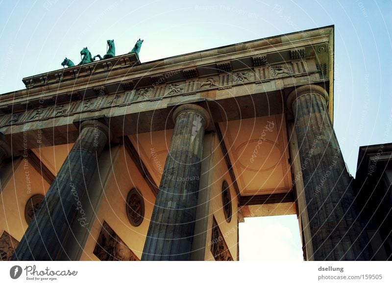 Partial view of Brandenburg Gate from bottom to top Berlin Capital city Summer Blooming Light Rider Carriage Horse Statue Monument Monumental Landmark Halo