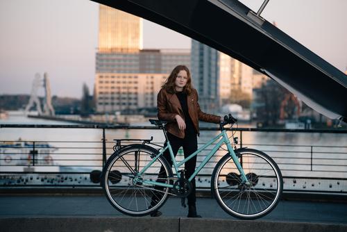 CYCLING WOMAN Vacation & Travel Tourism Sightseeing City trip Bicycle Closing time Human being Feminine Young woman Youth (Young adults) Woman Adults 1