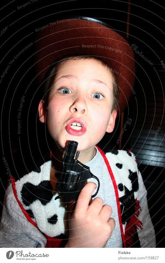 Attention, this is a robbery ... Cowboy Duel Wild West Carnival Carnival costume Costume Threat Dangerous Boy (child) Anger Aggravation Child Tyranny Problem