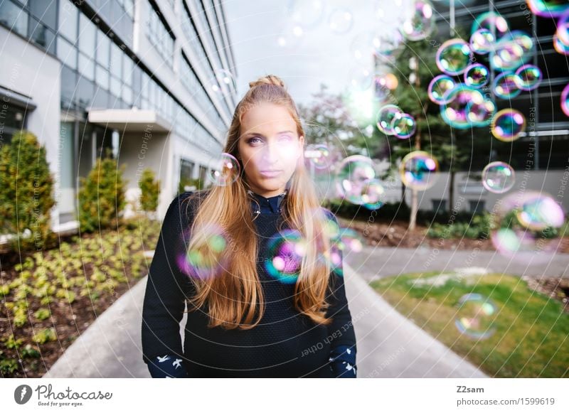 Young woman with soap bubbles in industrial environment Feminine Youth (Young adults) 1 Human being 18 - 30 years Adults Park Building Facade Blonde Long-haired