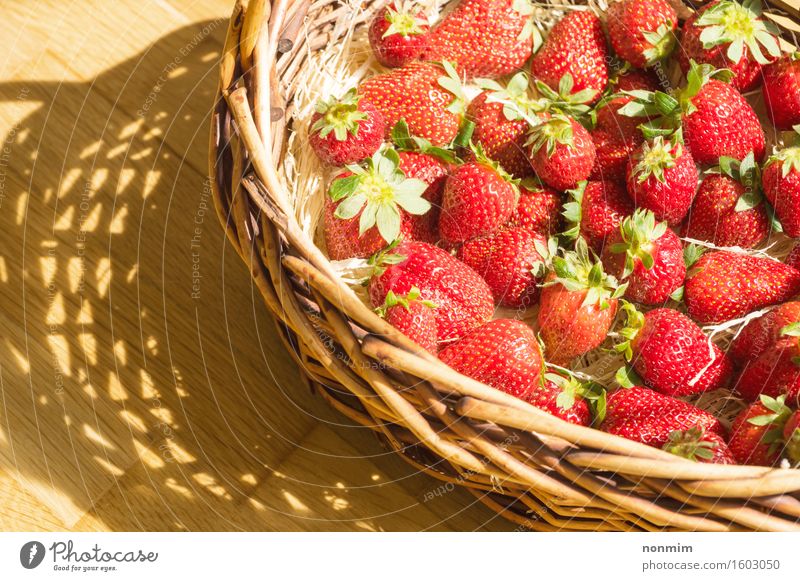 Basket with strawberry on table, sunny shadow Fruit Eating Diet Healthy Eating Summer Nature Plant Leaf Container Fresh Bright Small Green Red White Strawberry