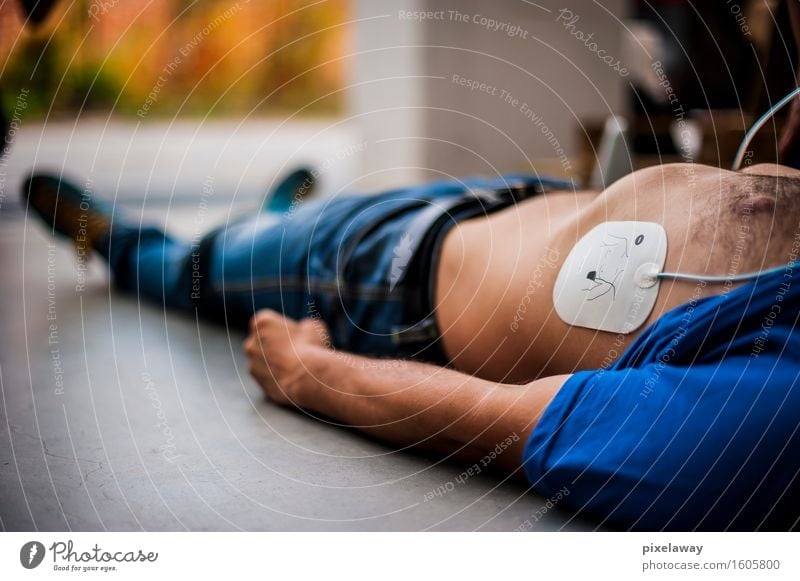 unconscious man with defibrillator pad Healthy Health care Medical treatment Human being 1 resuscitation cpr aed cardiopulmonar resuscitation cardiac massage