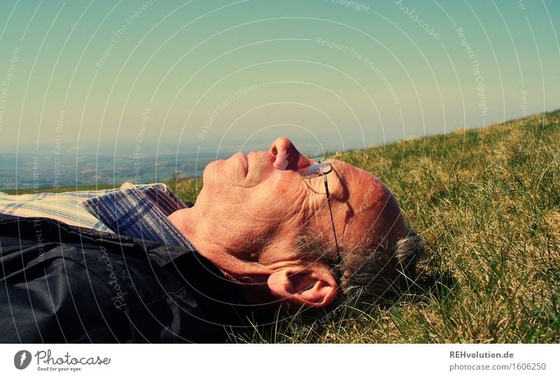 Senior lies in a meadow Human being Masculine Man Adults Male senior 1 45 - 60 years 60 years and older Senior citizen Environment Nature Landscape Plant Sky