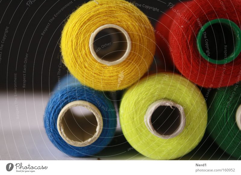 Batch processing. Sewing thread Colour Multicoloured Coil Hollow Blue Red Yellow Rolled Consecutively Round Section of image Partially visible Detail