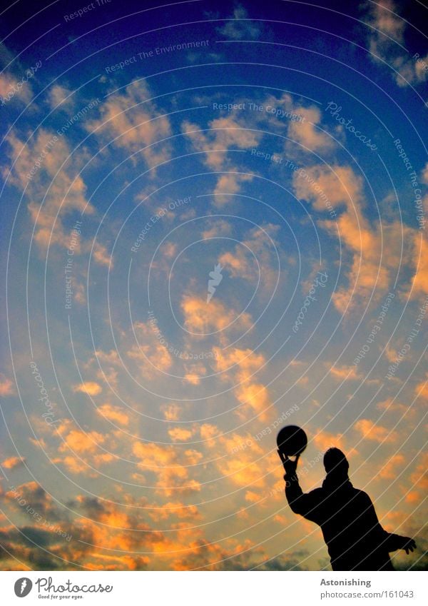 The wohle world in his hand! Human being Hand Ball Earth Sky Clouds Moody Shadow Light Sunbeam Dark Sports Playing