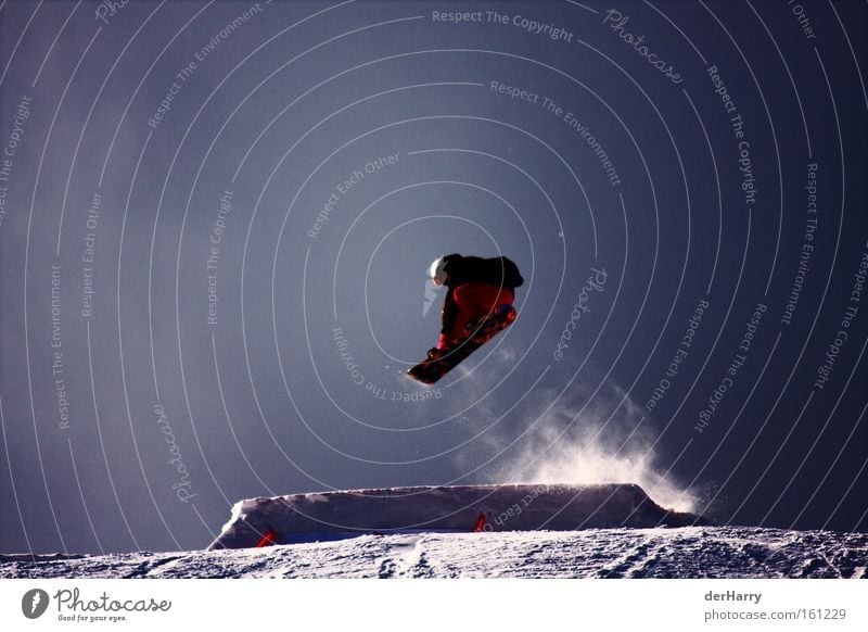 Ride the Snow Snowboard Air Style Jump Contrast Winter Blue Winter sports Sports Playing Exterior shot Colour photo 1 Tall Freestyle Snowboarder Snowboarding