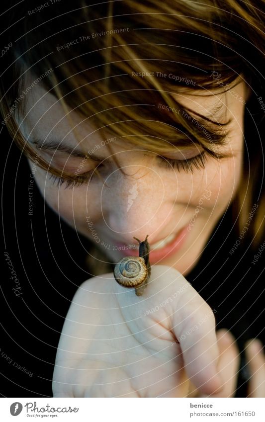 snail kiss Woman Snail Human being Snail shell Kissing Slowly Animal Laughter Nature Attractive Carrying Love of animals Love of nature Face of a woman