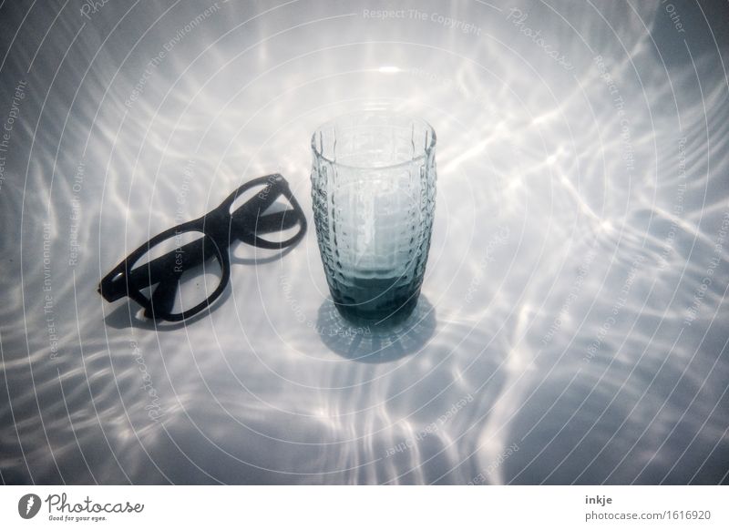 A glass of water from Tlön Nutrition Beverage Drinking water Glass Eyeglasses Water Exceptional Whimsical Surrealism Water reflection Still Life Colour photo