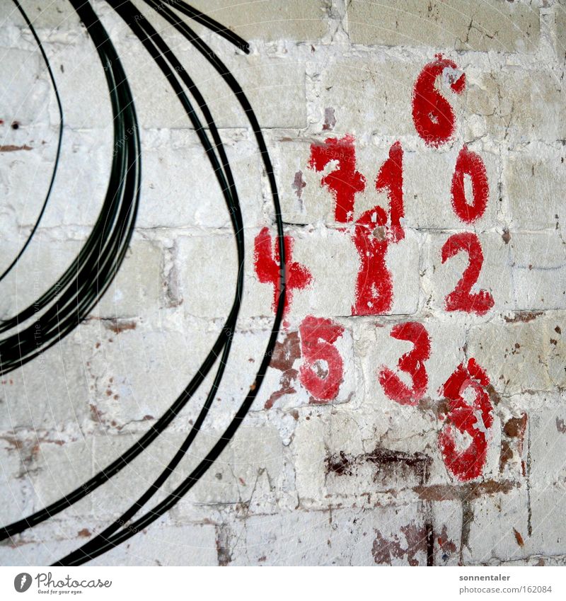tell me what Digits and numbers Colour Red Wall (building) Wall (barrier) Stone Cable Painting and drawing (object) Draw Numbers Classification Detail Playing