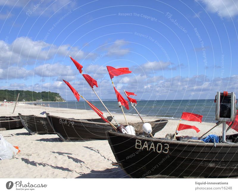 Flags in the wind Beach Watercraft Clouds Ocean Rügen Wind Sky