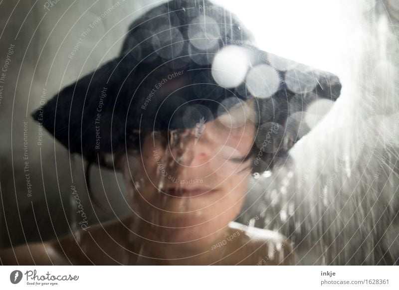 Shower. Shower. Woman Adults Life Face 1 Human being Water Drops of water Bad weather Storm Rain Protective clothing Hat rain hat Blur Splash of water