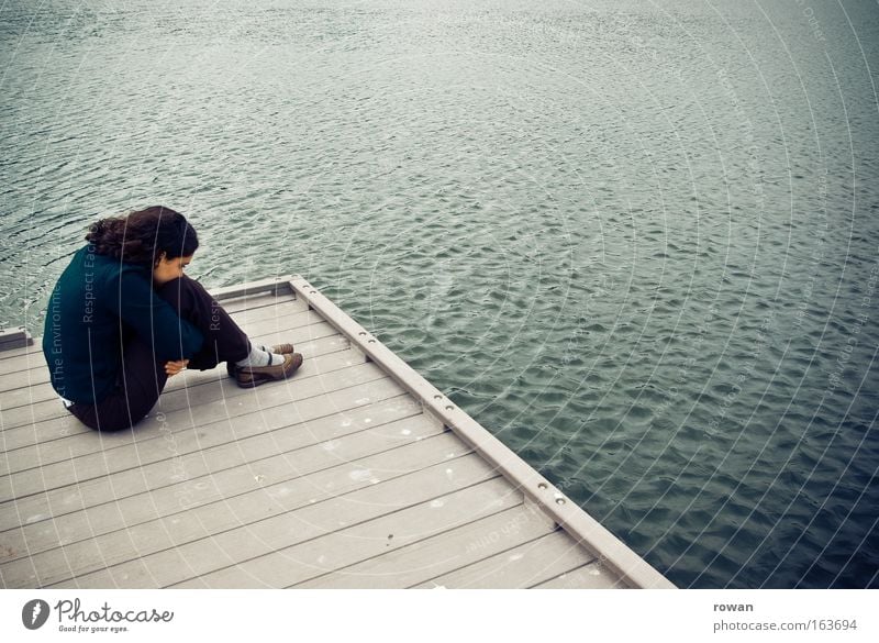 Sad Colour photo Subdued colour Exterior shot Neutral Background Day Young woman Youth (Young adults) Woman Adults 1 Human being Water Lakeside Ocean Crouch Cry