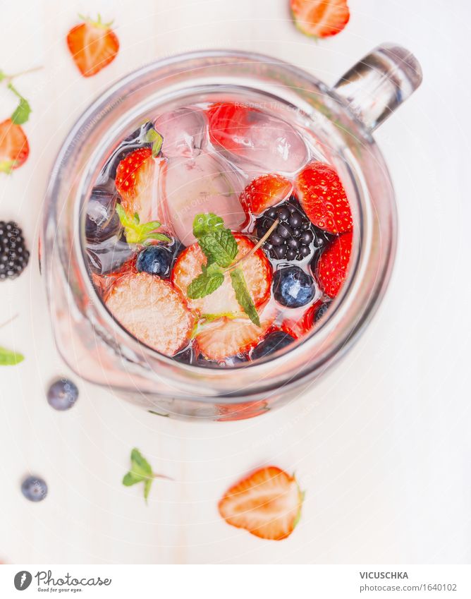 Jug with berries water and ice cubes Food Fruit Beverage Cold drink Drinking water Juice Crockery Style Design Healthy Eating Athletic Fitness Life Summer Water